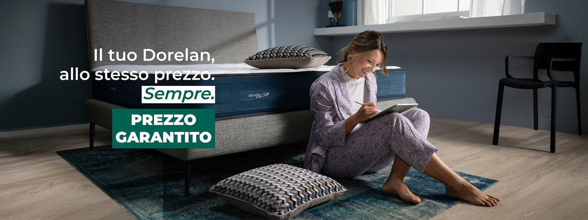 ragazza disegna su ipad di fianco ad un letto + materasso dorelan a prezzo garantito cons critta il tuo dorelan, allo stesso prezzo, sempre
