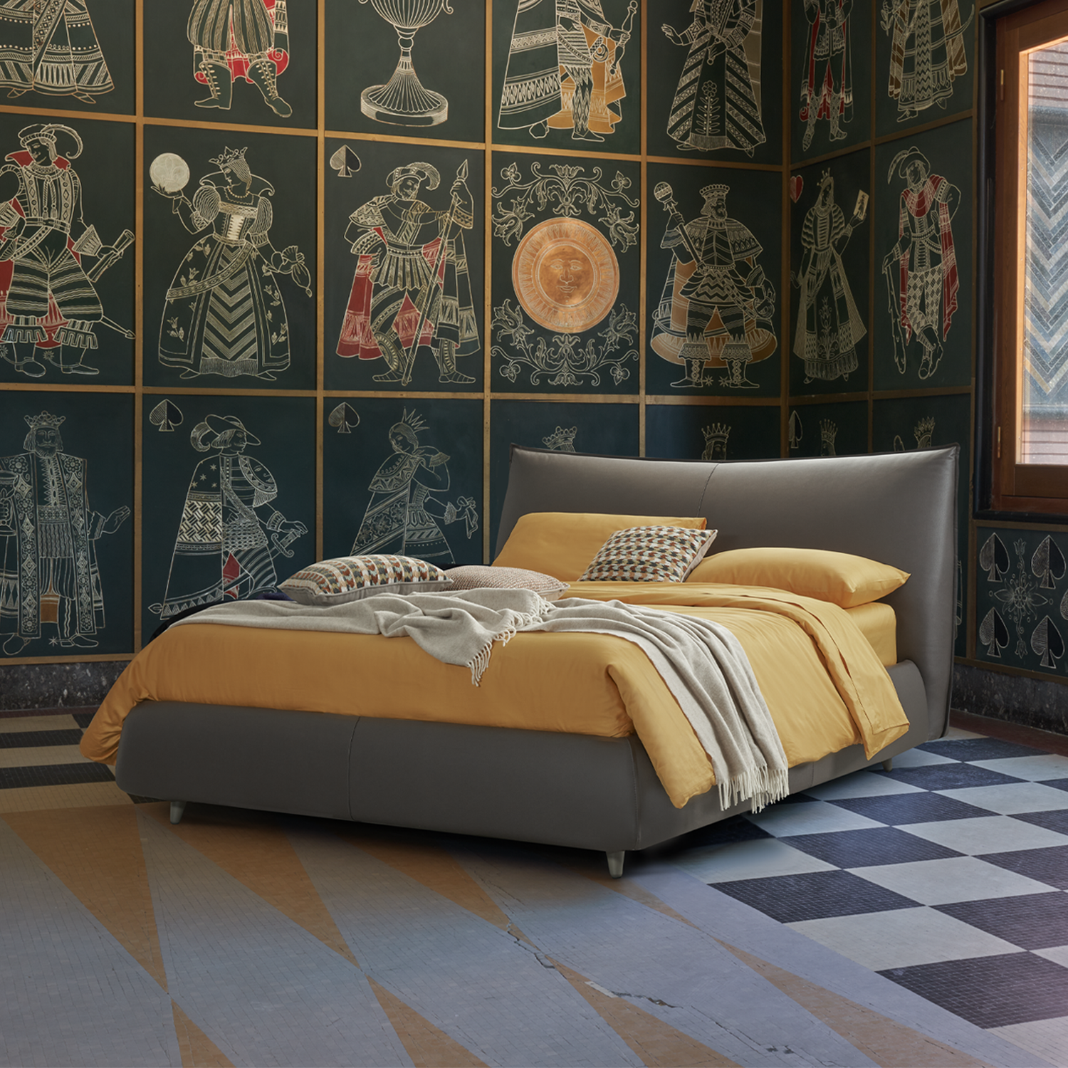 man letto di design dorelan. letto imbottitto in testa di moro con lenzuola gialle